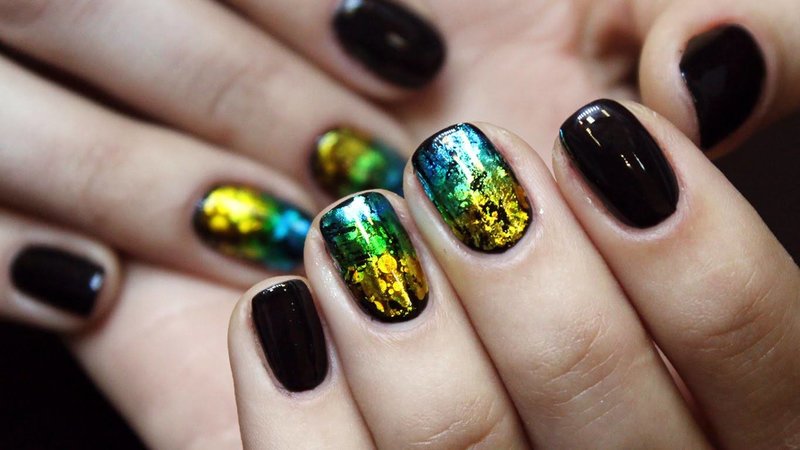 Black manicure with colored foil