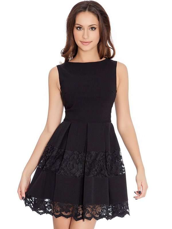 Girl in a black cocktail dress with lace on a skirt