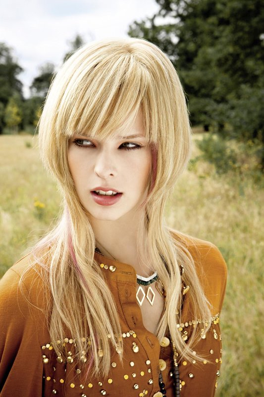 Girl with haircut beanie on long hair with bangs