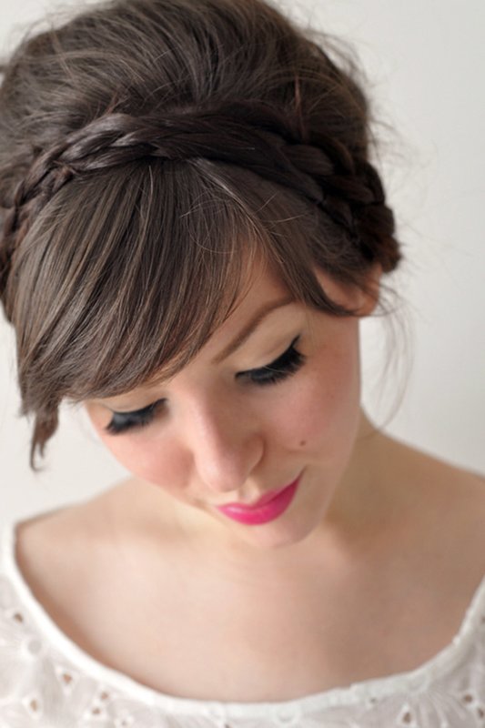 Girl with a bun and oblique bangs