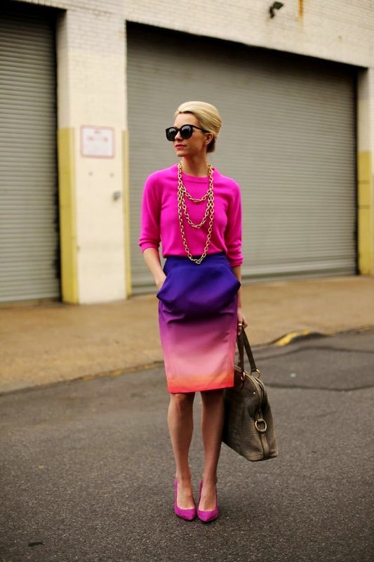 Girl in a bright pink sweater and skirt with a smooth gradient transition