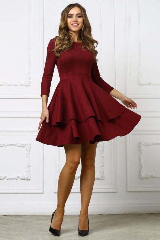 Girl in a burgundy puffy cocktail dress