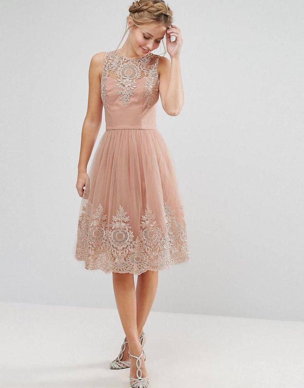 Girl in a beige midi cocktail dress with lace