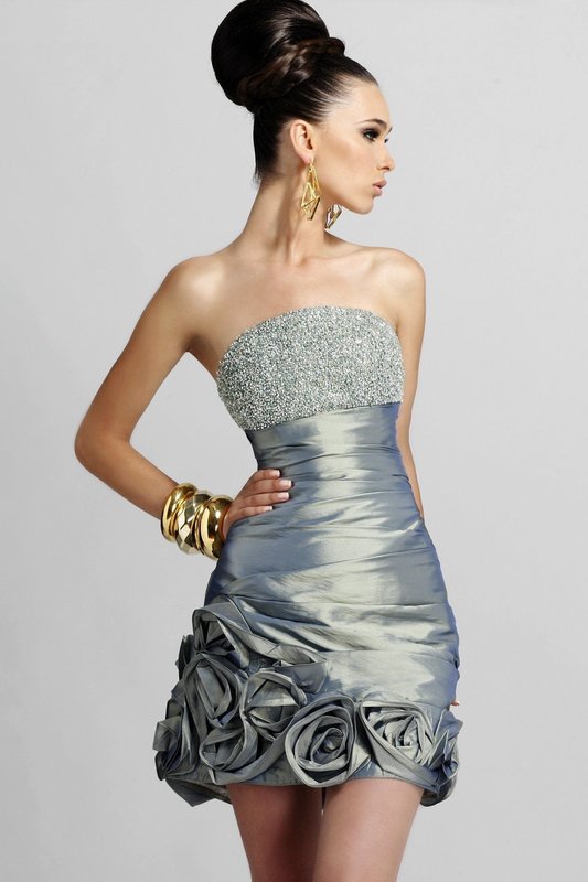 Girl in a cocktail dress with rhinestones on the bodice