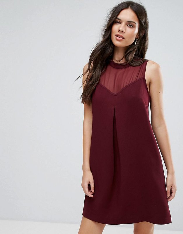 Girl in a burgundy A-line cocktail dress with a cut-out heart