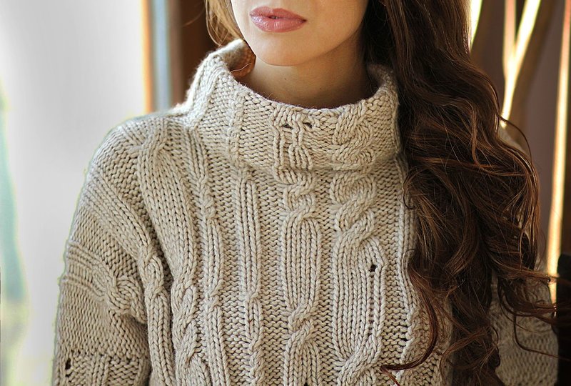 Girl in a sweater with an original knit