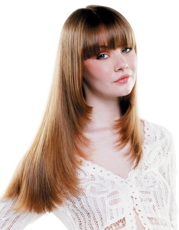 Girl with a haircut ladder for long hair combined with bangs