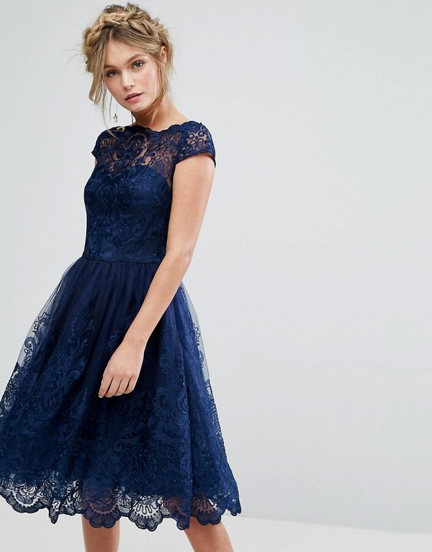 Girl in a blue lace cocktail dress