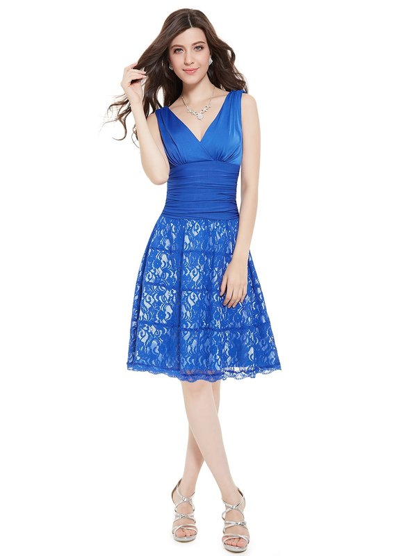 Girl in a blue cocktail dress with lace on a skirt