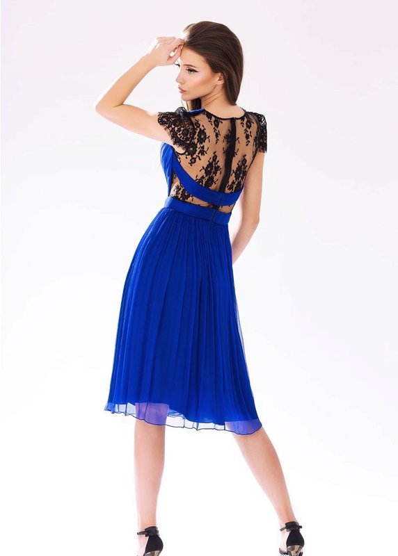 Girl in a blue cocktail dress with lace on her back