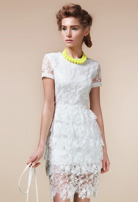 Girl in a white lace cocktail dress