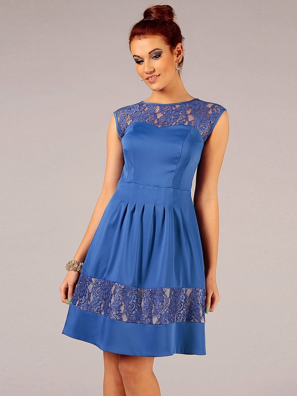 Girl in a blue cocktail dress with lace accents