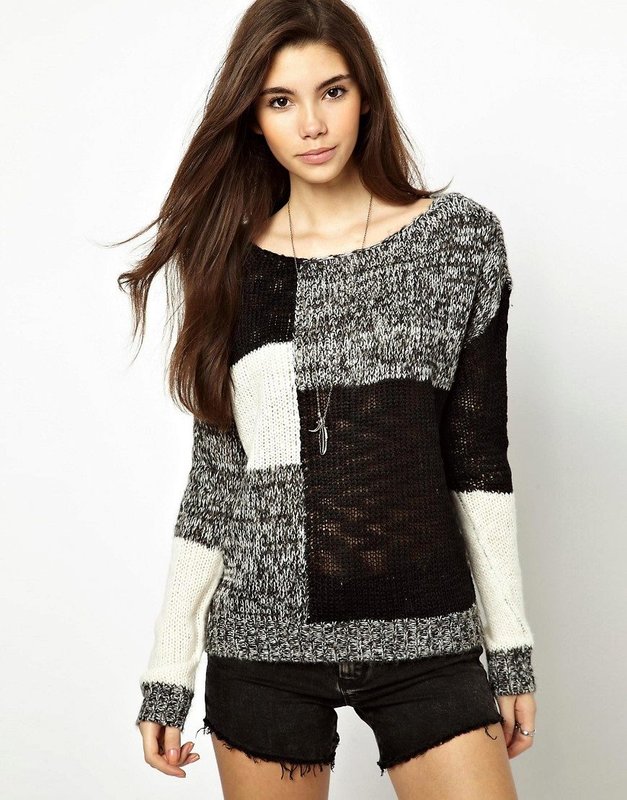 Girl in a patchwork style sweater