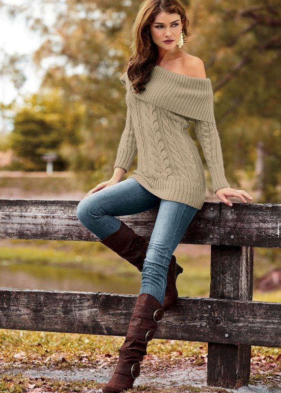 Girl in a sweater with bare shoulders and jeans