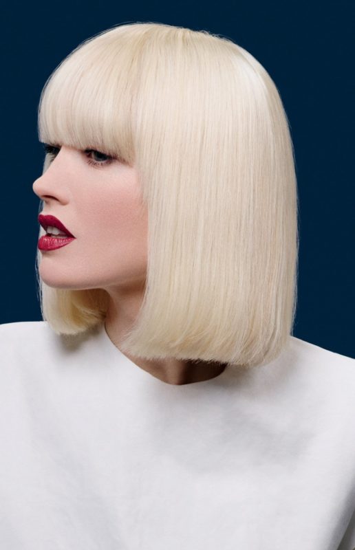 Girl with a straight cut haircut and a long straight bang