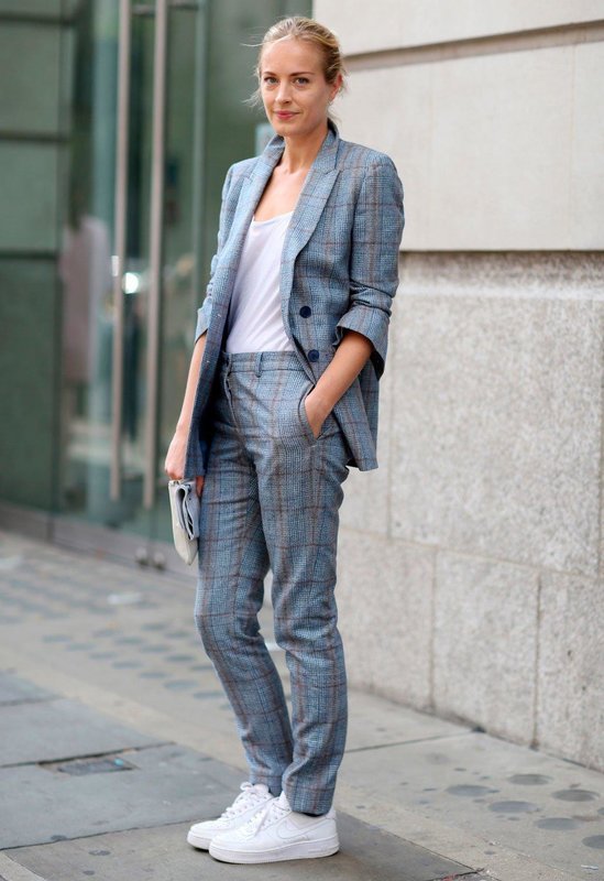 Girl in sneakers and trousers.