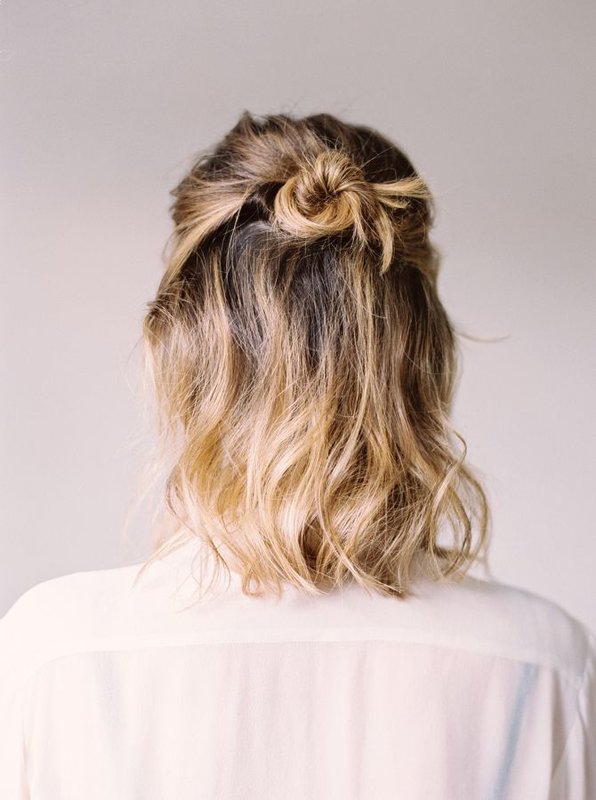 Girl with bun hair styling