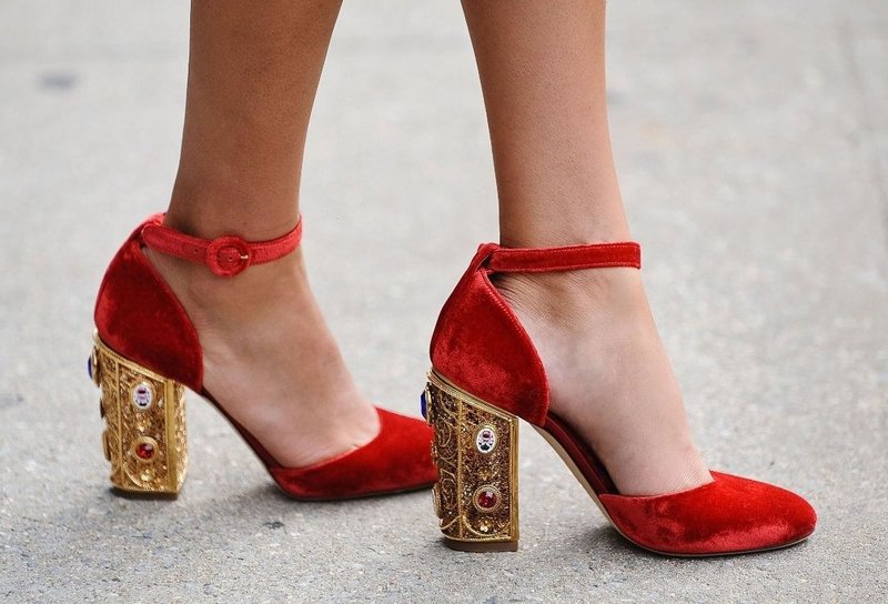 Red shoes with a strap and an unusual heel