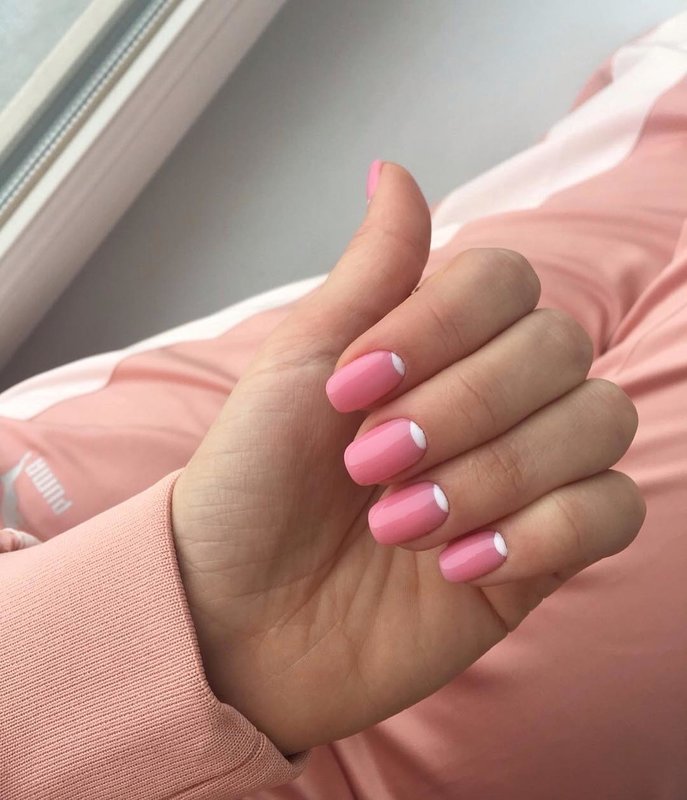 Pink manicure with white holes