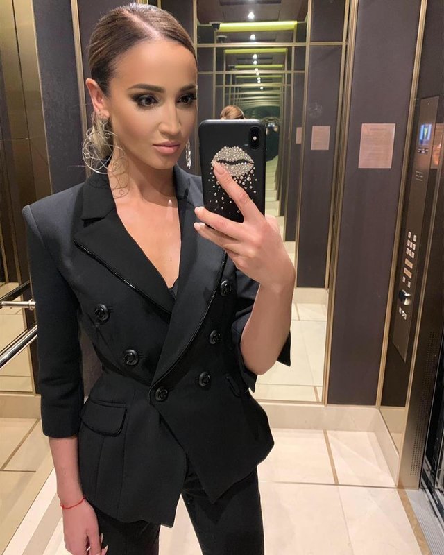 Olga Buzova in a suit