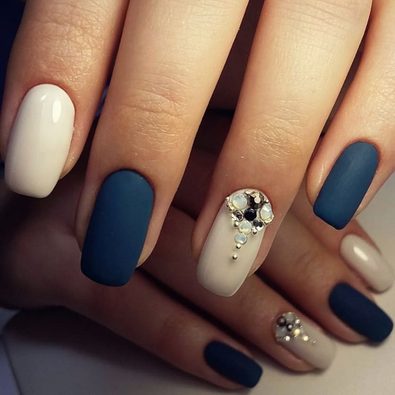 Matte dark blue nails with rhinestones