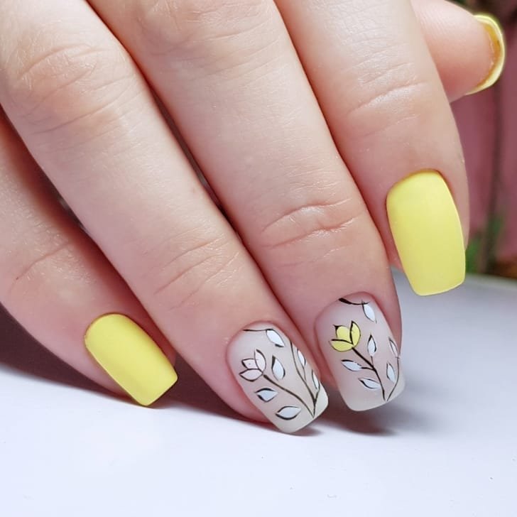 yellow manicure and minimalist drawings