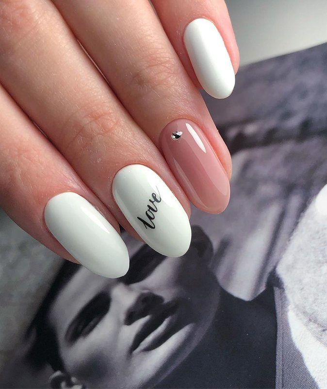 White manicure with stickers.