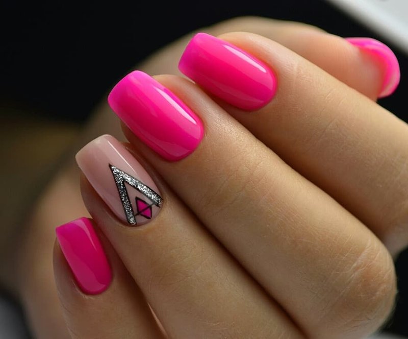 Neon pink manicure with design.