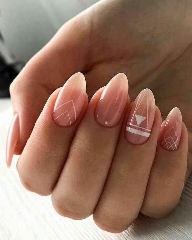 Geometry with white varnish on a nude manicure.