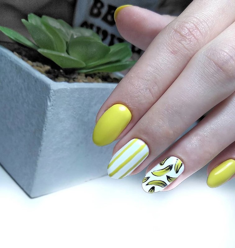 Yellow manicure with bananas.