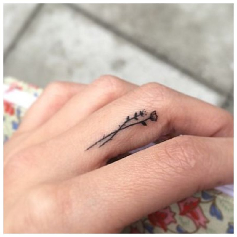 Small finger tattoo