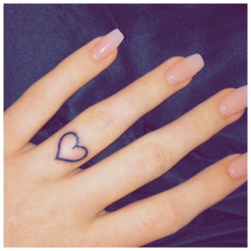 Finger heart tattoo