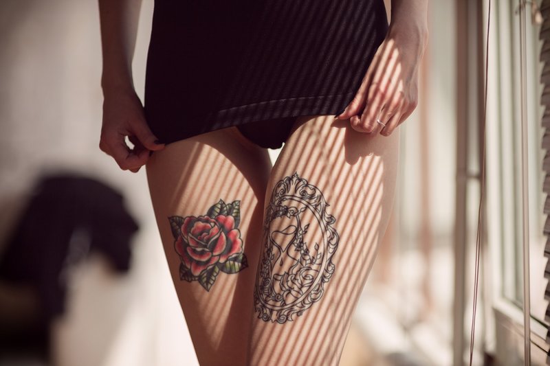 Tattoo on the hips on both legs