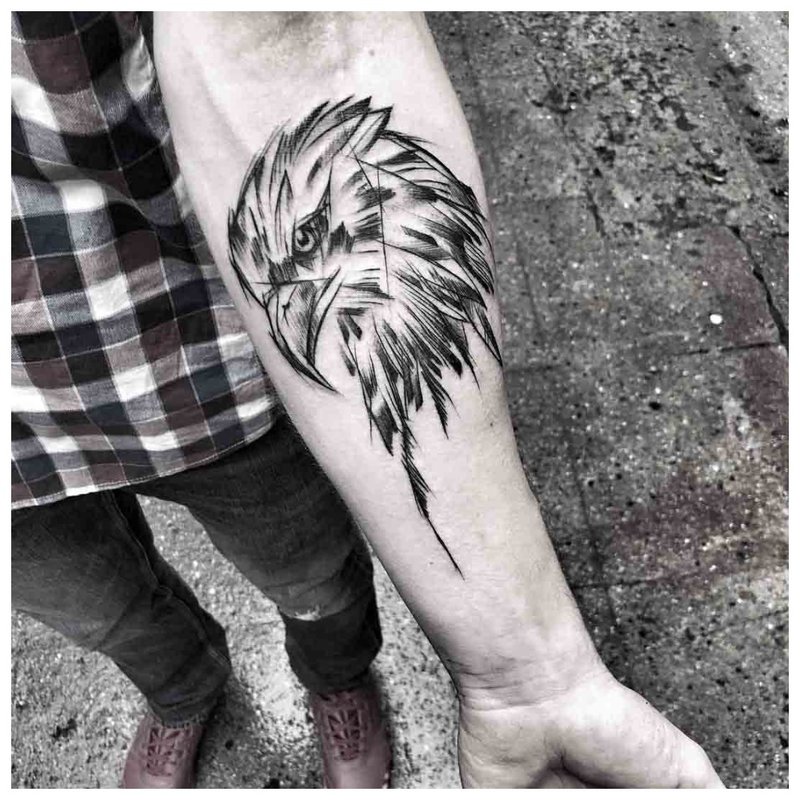 Bird forearm tattoo on men