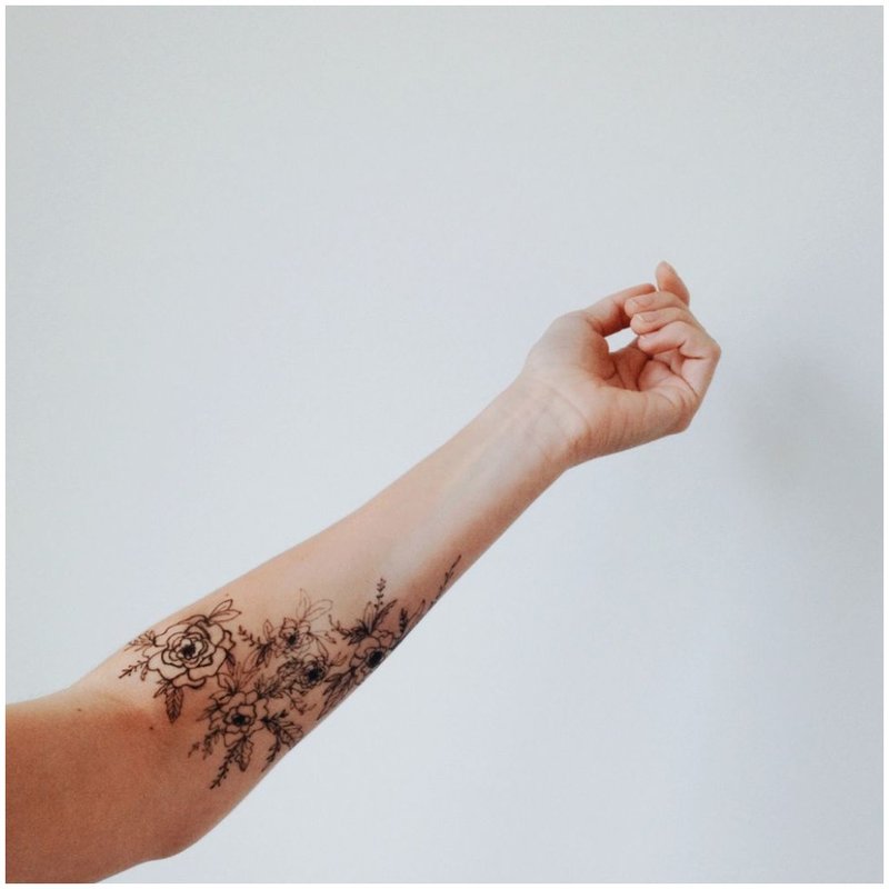 Tattoo on a hand with flowers