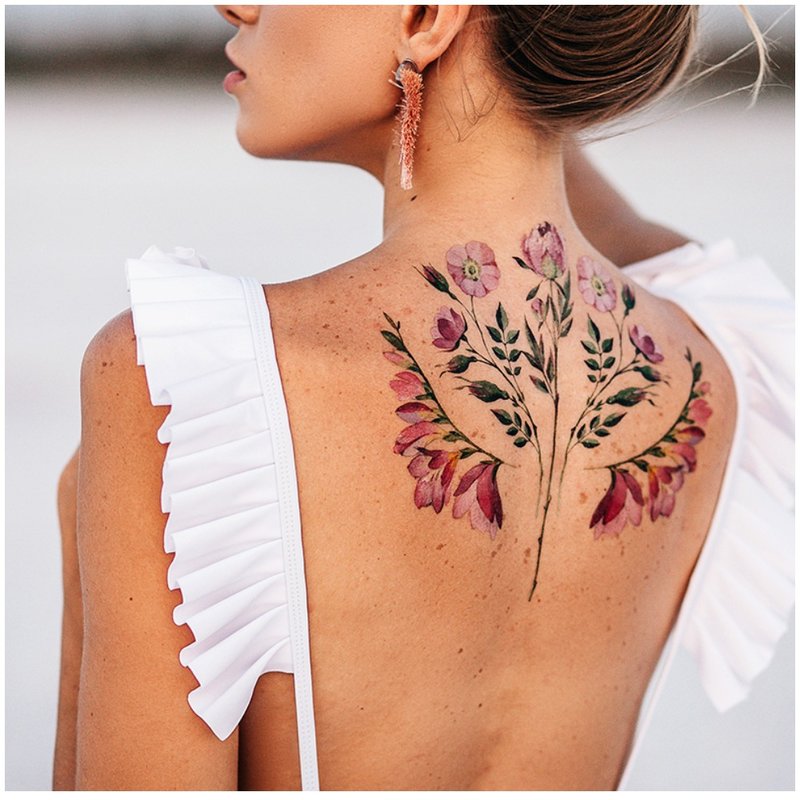 Watercolor tattoo of flowers