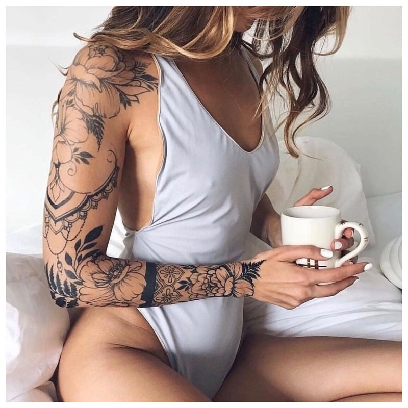 Female full arm tattoo