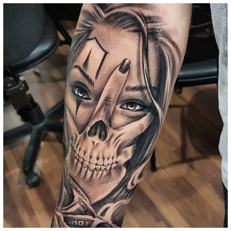 Cheeky man tattoo on the arm