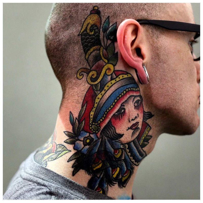 Bright tattoo on the neck behind the ear