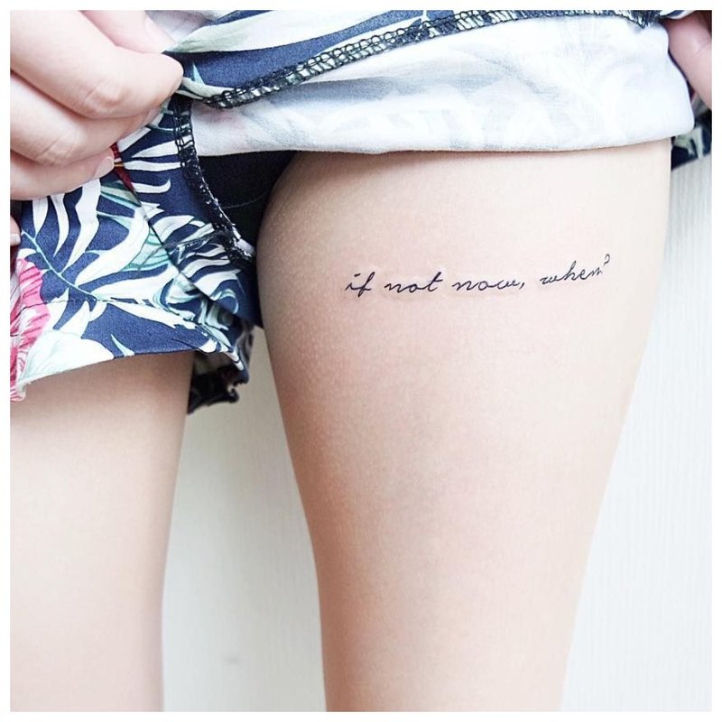 Beautiful tattoo inscription on the leg