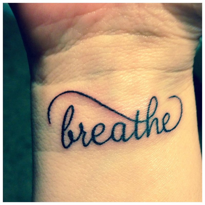 Breathe - an inscription for a tattoo on the wrist