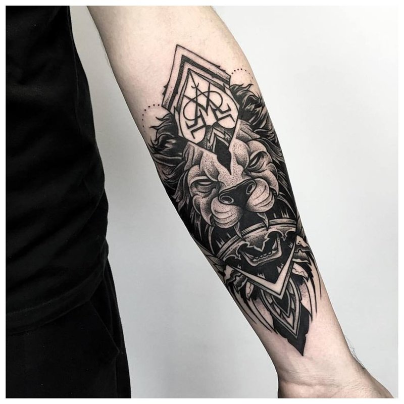 Animal theme tattoo on the forearm of a man