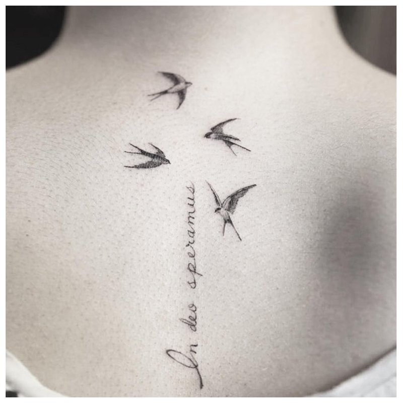 Tattoo inscription with birds