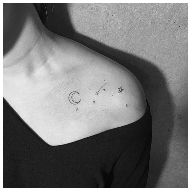 Original moon tattoo on the collarbone