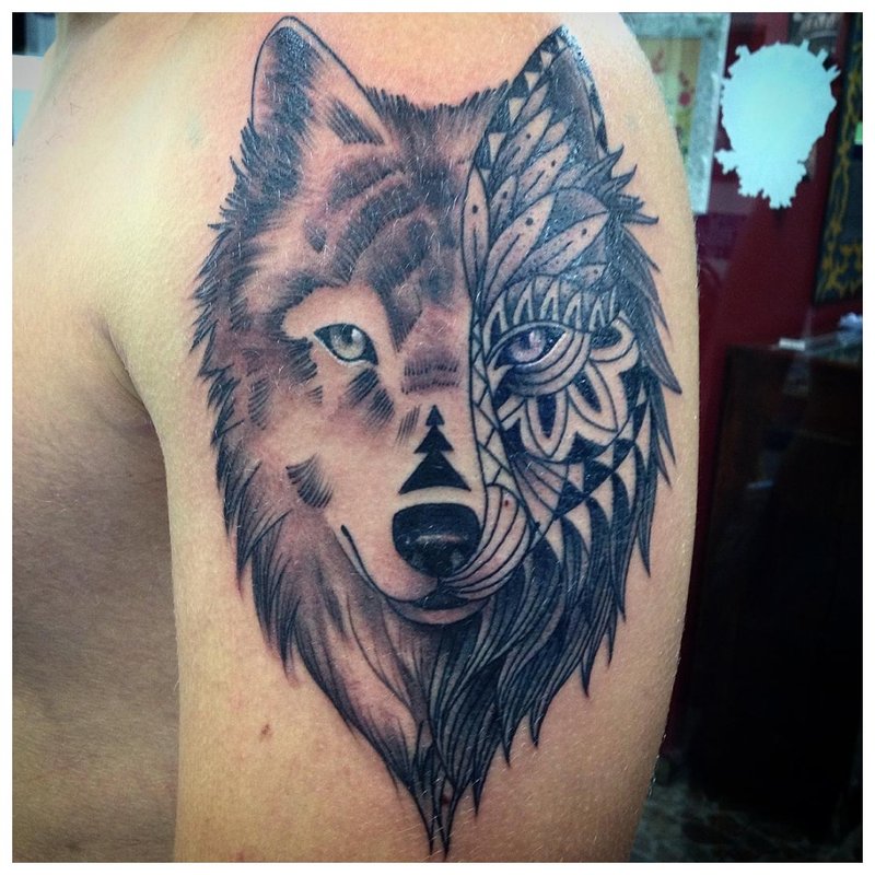 Different styles of wolf tattoo on the shoulder