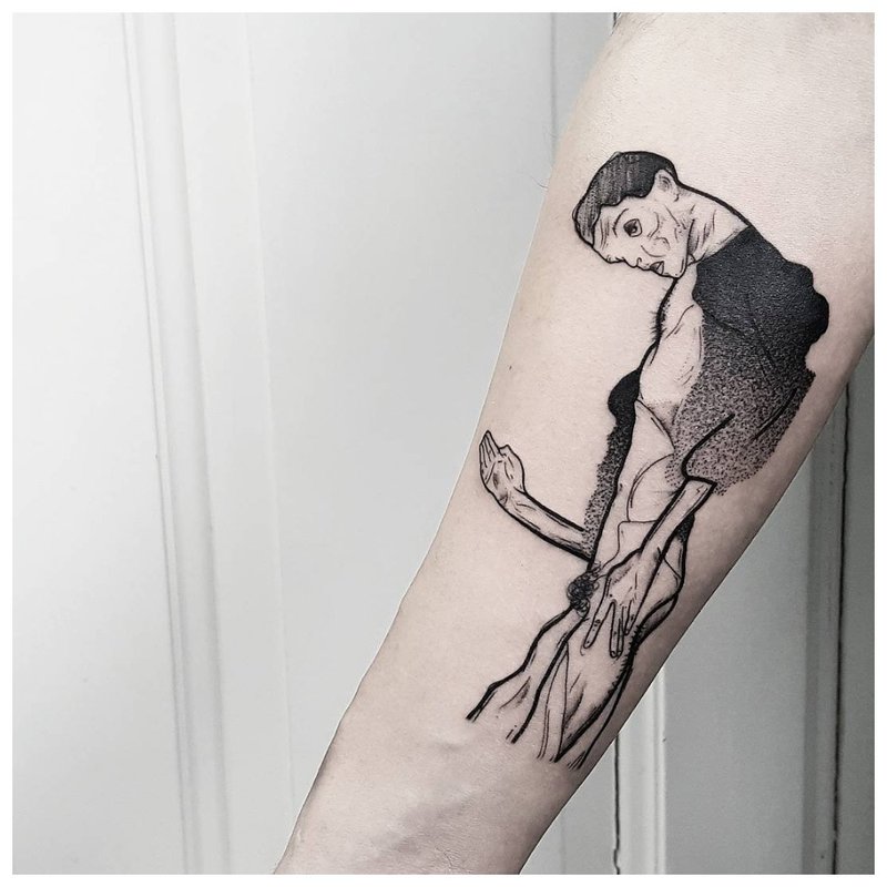 Man silhouette - tattoo on man’s arm