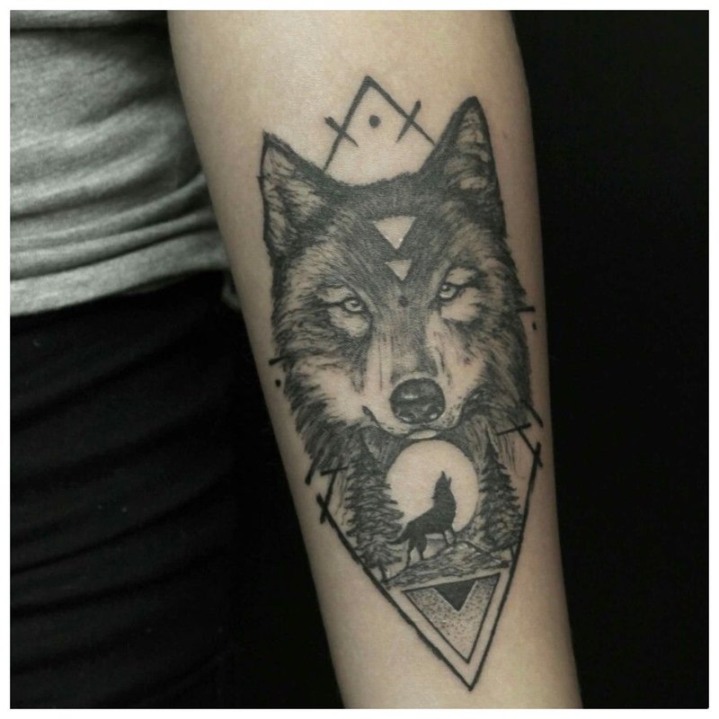 Wolf and geometric figure - tattoo on the arm