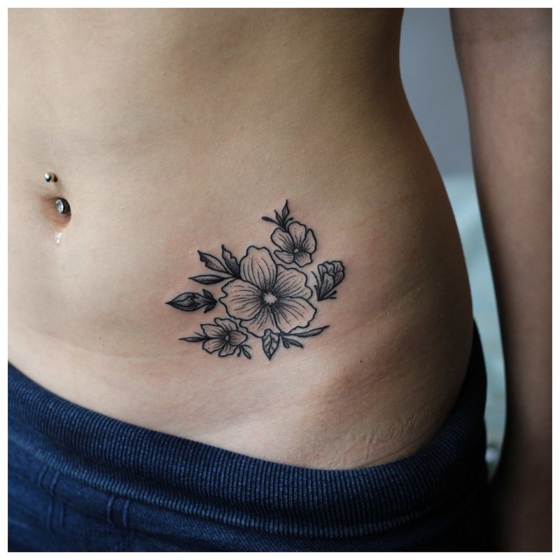 Large flower - hip tattoo