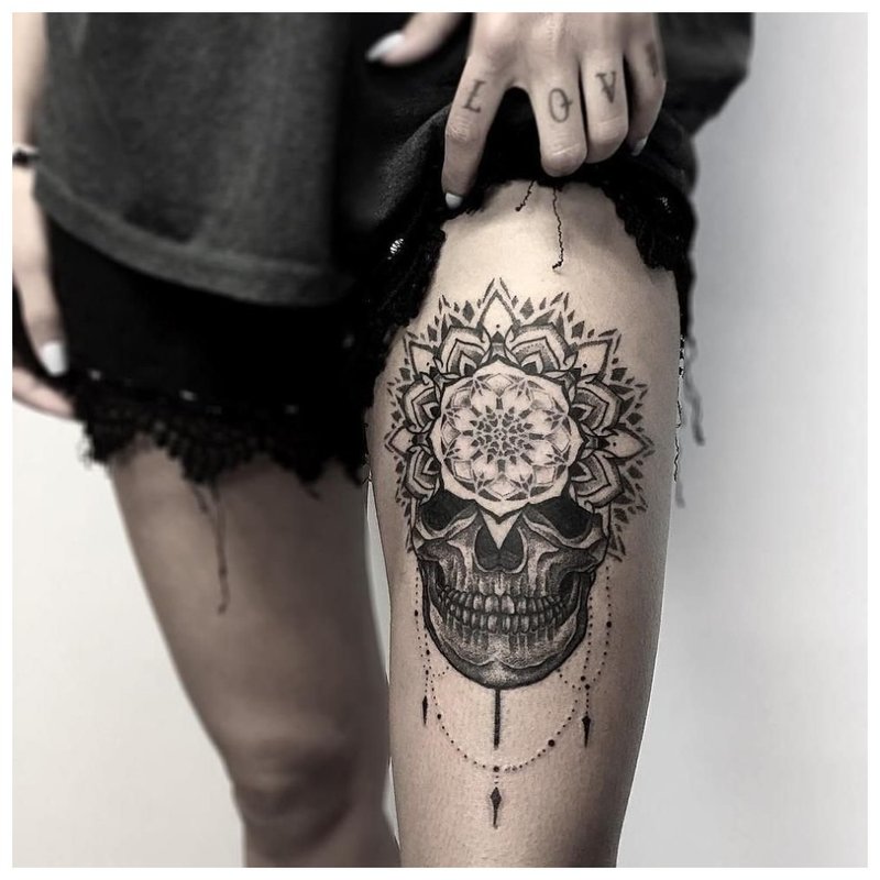 Tattoo on a girl’s thigh