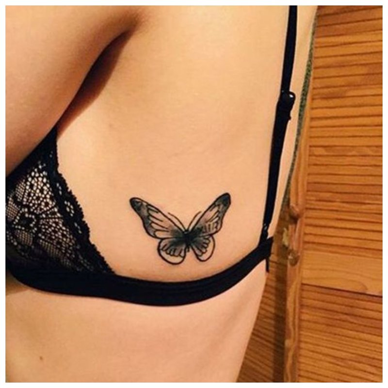 Butterfly tattoo on a girl's body